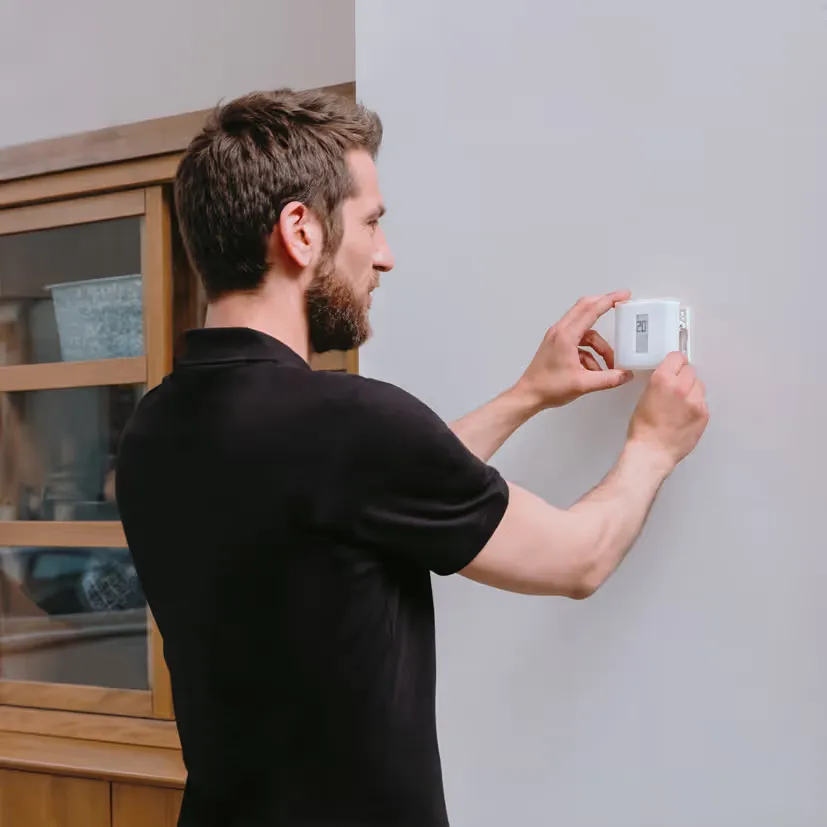 HVAC technician performing thermostat repair Denver