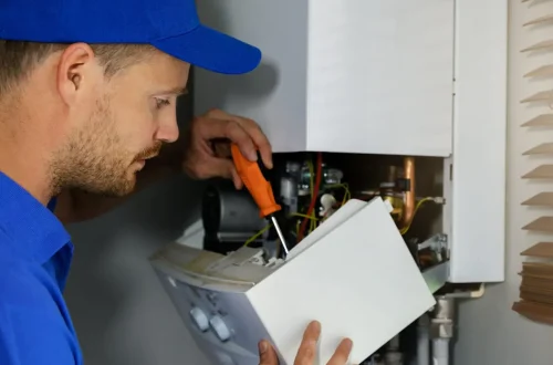 Heating repair Denver technician servicing furnace